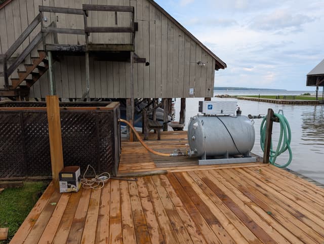 New decking run along the boathouse on the water side — Georgian Bay, Ontario