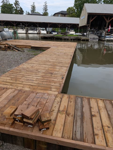 New decking carried along the shoreline, the next boards stacked and ready. — Georgian Bay, Ontario