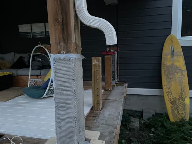 Column base wrapped and combed with a mortar scratch coat. — Georgian Bay, Ontario
