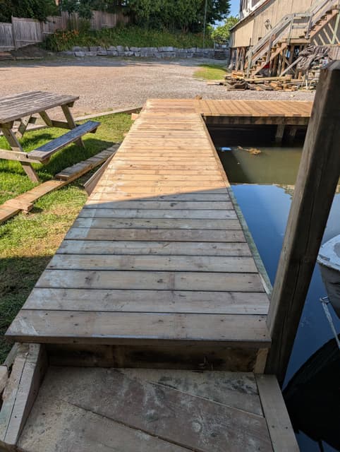 Fresh decking laid across the ramp and landing where it meets the water. — Georgian Bay, Ontario