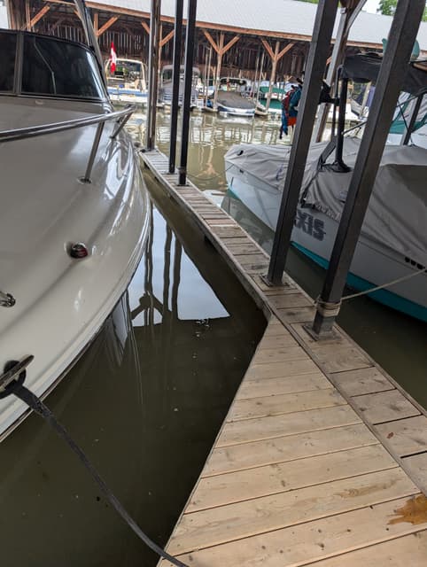 Fresh decking on the narrow finger dock running between two slips. — Georgian Bay, Ontario
